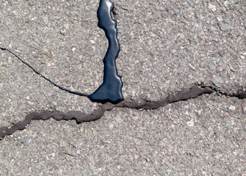 Why You Should Repair Asphalt Cracks and Potholes Before Winter Grand Rapids Asphalt Paving
